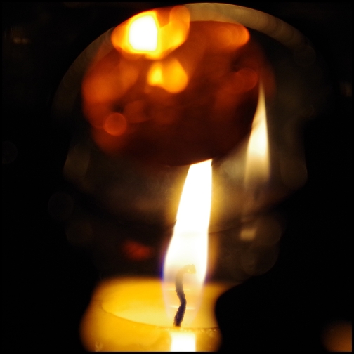 Candle flame with reflection